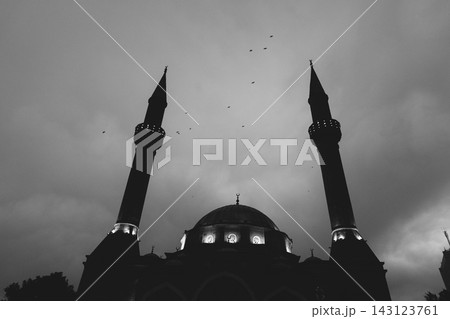 Baku Mosque of the Martyrs stands against the cloudy sky during dusk, black and white photo Baku Mosque of the Martyrs stands against the cloudy sky during dusk, black and white photo 143123761