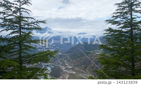 Artvin viewpoint frames city, wide panorama through conifer trees above the Coruh River valley in Turkey 143123839