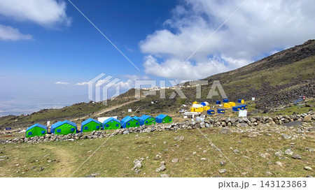 Clouds cross Ararat base camp, wide view of tents on a rocky slope at 3,300 meters in eastern Turkey Clouds cross Ararat base camp, wide view of tents on a rocky slope at 3,300 meters in eastern Turkey 143123863