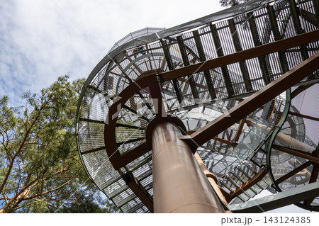 Winding metal staircase of an outdoor observation tower rising into the sky Winding metal staircase of an outdoor observation tower rising into the sky 143124385