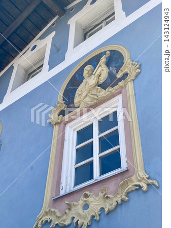 Blue house facade with a traditional angel fresco painting in Mittenwald, Bavaria, Germany Blue house facade with a traditional angel fresco painting in Mittenwald, Bavaria, Germany 143124943