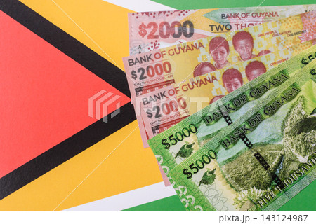 Guyana paper money, dollar banknotes and coins as currency for exchange or travel Guyana paper money, dollar banknotes and coins as currency for exchange or travel 143124987