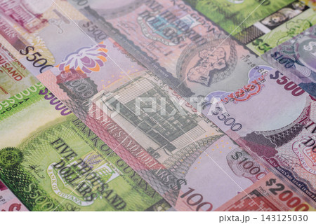 Guyana paper money, dollar banknotes and coins as currency for exchange or travel Guyana paper money, dollar banknotes and coins as currency for exchange or travel 143125030