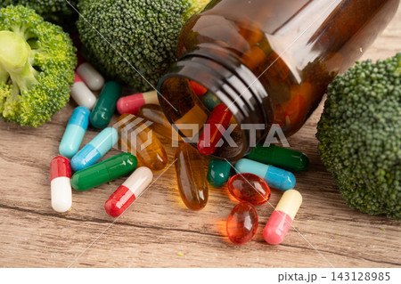 Drug with broccoli vegetable for healthy food. Drug with broccoli vegetable for healthy food. 143128985