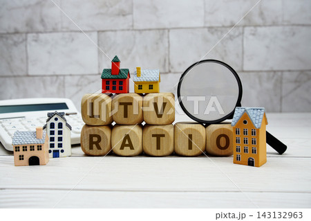 LTV Ratio alphabet letters with house model, calculator and magnifying glass 143132963