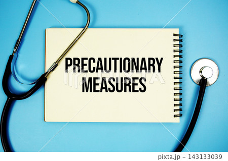 Precautionary Measures text with stethoscope and magnifying glass on blue background Precautionary Measures text with stethoscope and magnifying glass on blue background 143133039