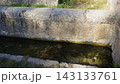 Old stone channel flowing with clear water. Nacimiento rio Arandilla 143133761