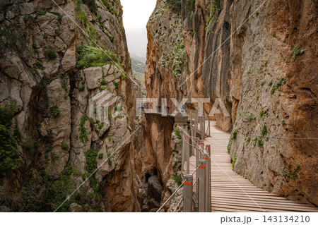 ooden boardwalk clinging to sheer canyon walls at Caminito del Rey, Spain ooden boardwalk clinging to sheer canyon walls at Caminito del Rey, Spain 143134210