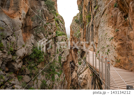 ooden boardwalk clinging to sheer canyon walls at Caminito del Rey, Spain ooden boardwalk clinging to sheer canyon walls at Caminito del Rey, Spain 143134212