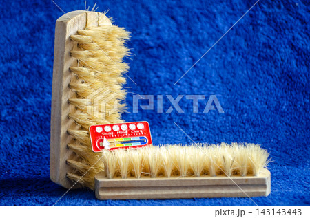 Brushes for cleaning and crafting in different sizes on a blue background Brushes for cleaning and crafting in different sizes on a blue background 143143443