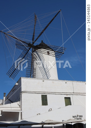 White traditional spanish windmill architecture under blue sky White traditional spanish windmill architecture under blue sky 143144863