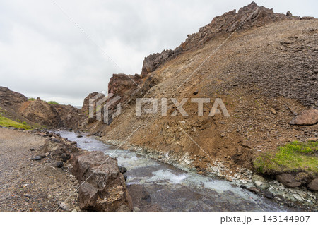 Natural hot spring river near Husafell in Iceland Natural hot spring river near Husafell in Iceland 143144907