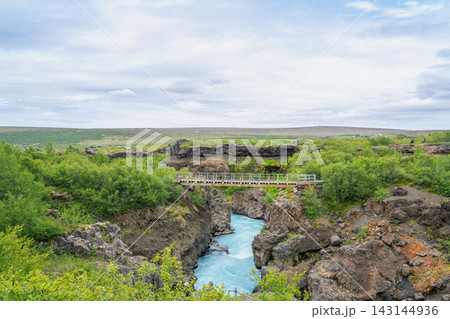Footbridge over turquoise river in Barnafossar, Iceland Footbridge over turquoise river in Barnafossar, Iceland 143144936
