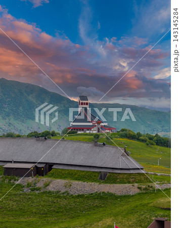 Aerial Lofoten church and Viking longhouse at golden hour, Norway Aerial Lofoten church and Viking longhouse at golden hour, Norway 143145284