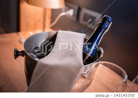 Sparkling Wine in Ice Bucket by Lamp at Lodge, San Domenico, Italy 143145350