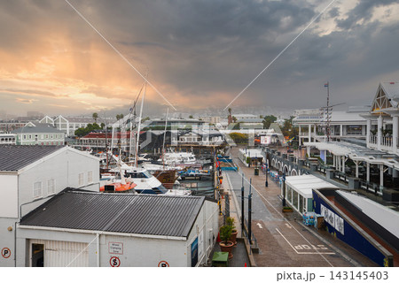 Victoria and Alfred Waterfront in Cape Town Under Stormy Sunset Sky Victoria and Alfred Waterfront in Cape Town Under Stormy Sunset Sky 143145403