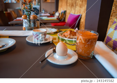 Breakfast table at luxury winter hotel dining room in Oberlech Breakfast table at luxury winter hotel dining room in Oberlech 143145582
