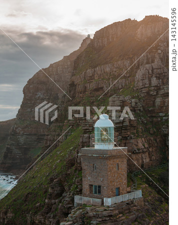 Aerial view of Cape Point lighthouse on rugged cliff near Cape Town 143145596