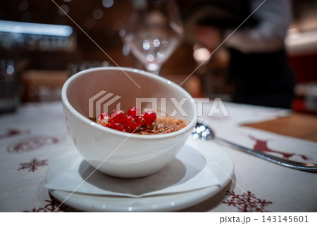 Refined dessert with red currants at San Domenico ski resort Refined dessert with red currants at San Domenico ski resort 143145601