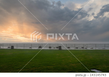 Dramatic Storm Clouds over the Sea Point Promenade in Cape Town Dramatic Storm Clouds over the Sea Point Promenade in Cape Town 143145743