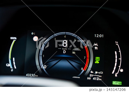 Close up Lexus RX 450h plus cluster shows 8 km per h, lane keeping and adaptive cruise icons, EV and HV status, battery and fuel, 6 C, 20 km per h limit, 43,232 km, 412 km range. Close up Lexus RX 450h plus cluster shows 8 km per h, lane keeping and adaptive cruise icons, EV and HV status, battery and fuel, 6 C, 20 km per h limit, 43,232 km, 412 km range. 143147206