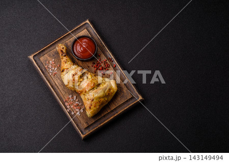 Grilled chicken quarter seasoned with mustard, spices, and salt. Grilled chicken leg Grilled chicken quarter seasoned with mustard, spices, and salt. Grilled chicken leg 143149494