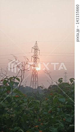 Electrical pylon and high voltage cables at dusk Electrical pylon and high voltage cables at dusk 143155660