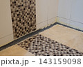 Bathroom Floor Waterproofing and silicone Sealant Repair Along Tile Edges 143159098