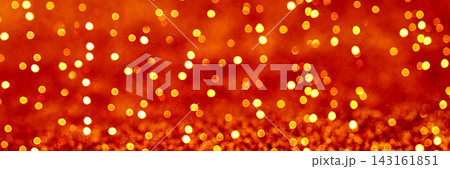 Warm golden bokeh glitter background for celebration 143161851