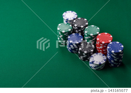 Multi colored gaming chips for betting in casino games. Betting chips Multi colored gaming chips for betting in casino games. Betting chips 143165077