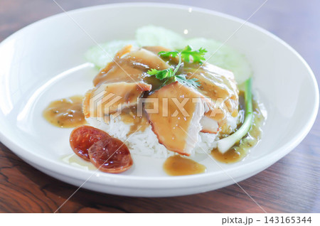 fried pork and rice or rice topped with pork with cucumber and sauce or pork and rice fried pork and rice or rice topped with pork with cucumber and sauce or pork and rice 143165344