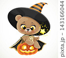 Cute teddy bear in a black cloak sitting on a halloween pumpkin with magic wand  143166044