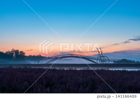 Sunrise Dawn over Misaeng Bridge with Water Reflection in Siheung Wetland, South Korea Sunrise Dawn over Misaeng Bridge with Water Reflection in Siheung Wetland, South Korea 143166489