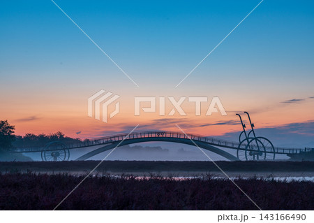 Sunrise Dawn over Misaeng Bridge with Water Reflection in Siheung Wetland, South Korea Sunrise Dawn over Misaeng Bridge with Water Reflection in Siheung Wetland, South Korea 143166490