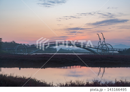 Sunrise Dawn over Misaeng Bridge with Water Reflection in Siheung Wetland, South Korea 143166495
