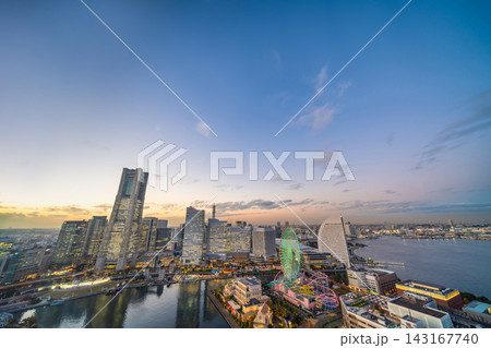Panoramic aerial view of Yokohama Minatomirai 21 skyline, cityscape with Landmark Tower and illuminated ferris wheel at twilight, Japan Panoramic aerial view of Yokohama Minatomirai 21 skyline, cityscape with Landmark Tower and illuminated ferris wheel at twilight, Japan 143167740