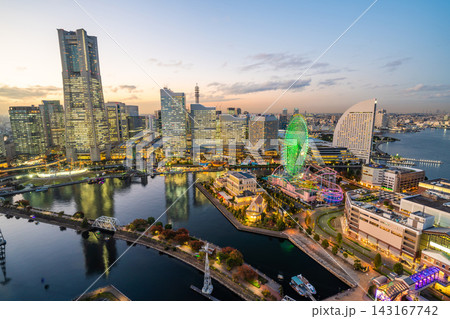 Panoramic aerial view of Yokohama Minatomirai 21 skyline, cityscape with Landmark Tower and illuminated ferris wheel at twilight, Japan 143167742