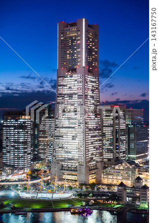aerial view of Yokohama Minatomirai 21 skyline, cityscape with Landmark Tower and illuminated ferris wheel at twilight, Japan 143167750