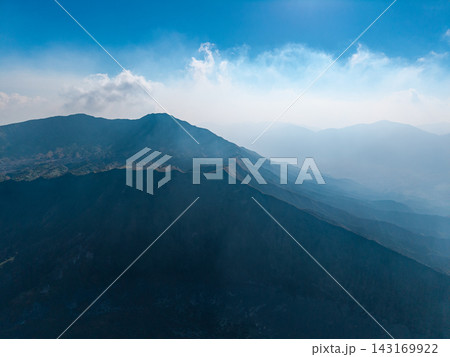 Majestic mountain rises against clear blue sky 143169922