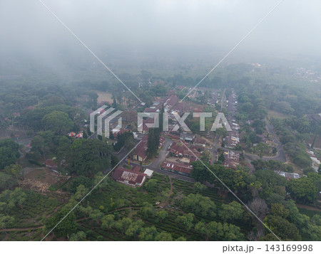 Aerial Wonosari Tea Plantation Amid Misty Hills and Village Aerial Wonosari Tea Plantation Amid Misty Hills and Village 143169998