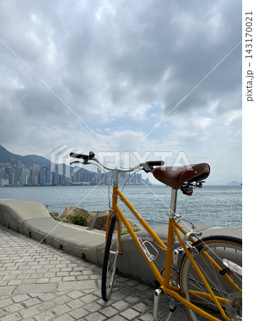 Yellow bicycle on West Kowloon Cultural District promenade in Hong Kong 143170021