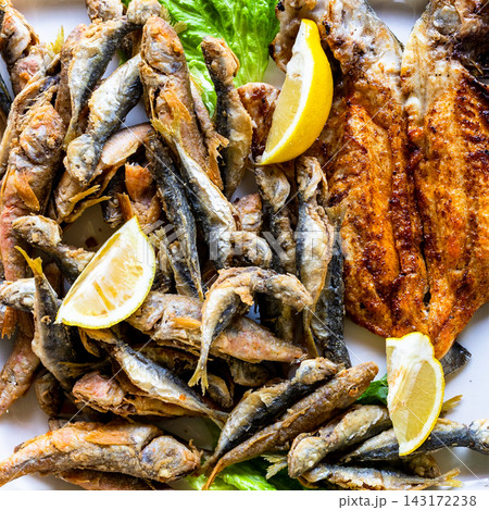 assortment of local fried fishes close-up on plate assortment of local fried fishes close-up on plate 143172238