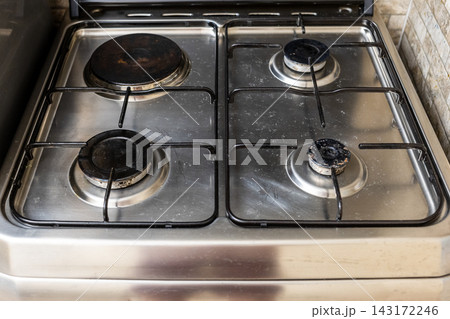 kitchen stove surface with gas and electric burner 143172246