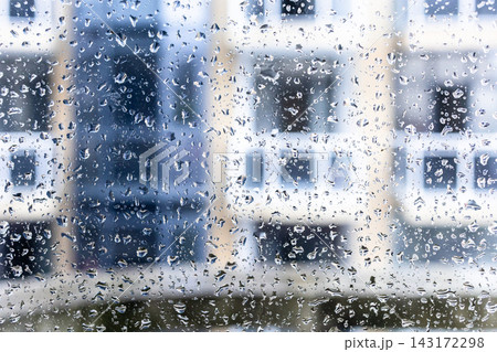 raindrops on window of urban house close-up raindrops on window of urban house close-up 143172298