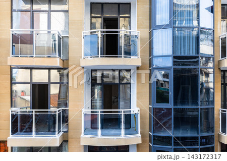 front view of balconies on facade of new building 143172317