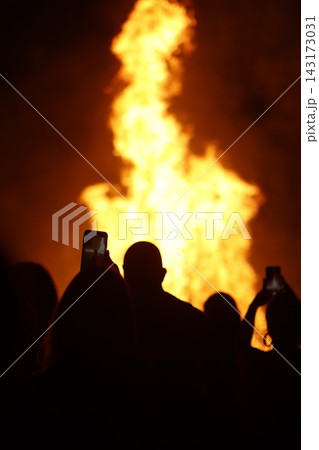 Crowd and fire at night in a summer event Crowd and fire at night in a summer event 143173031