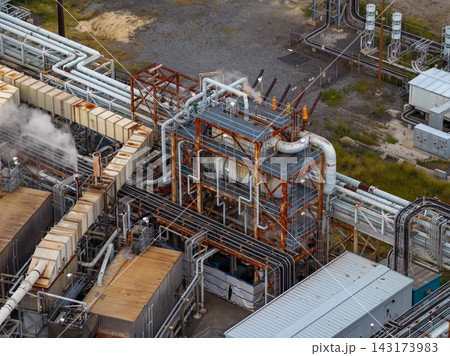 Telephoto aerial shot of rusting industrial power facility machinery 143173983