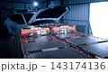 EV car service. Electric vehicle battery pack being serviced or inspected in automotive workshop. Large battery modules and high voltage components. Modern EV power systems. Lithium ion NMC NCA or LFP 143174136