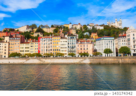 Colorful buildings on Saone river embankment in Lyon city, France Colorful buildings on Saone river embankment in Lyon city, France 143174342