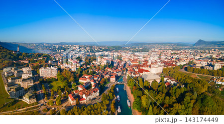 Aerial view of Annecy town and lake surrounded by mountains in France Aerial view of Annecy town and lake surrounded by mountains in France 143174449